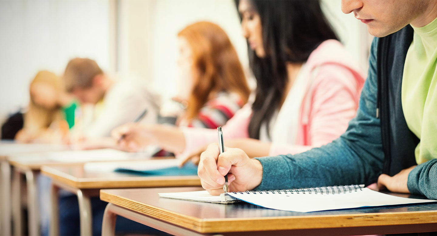 A line of students at desks