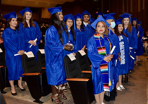 A group of students in graduation robes and caps